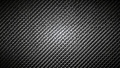 Obraz premium Carbon fiber diagonal weave texture creates a modern, high-tech look suitable for automotive, industrial, or tech-related designs and backdrops.