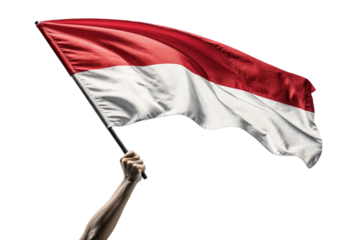 Hand holding the indonesian flag waving proudly isolated on transparent background