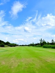 green golf course and blue sky