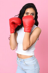 Women with boxing gloves, isolated pink background. Generative ai