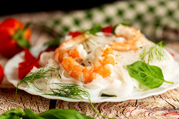 Asian lunch boiled rice noodles shrimp on a wooden table