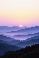 Obraz premium Misty mountain sunrise, soft colors, layered peaks