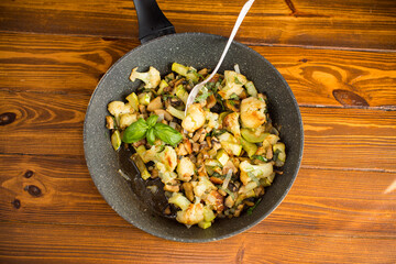 Fragrant vegetables with cauliflower in a frying pan