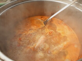 Cook meat stew in a pot