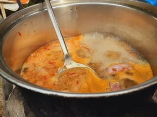 Cook meat stew in a pot