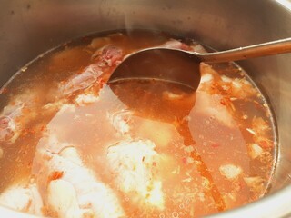 Cook meat stew in a pot
