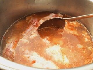 Cook meat stew in a pot