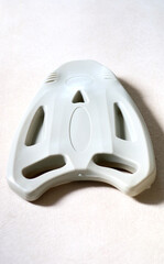 Plastic float board to help practice swimming.