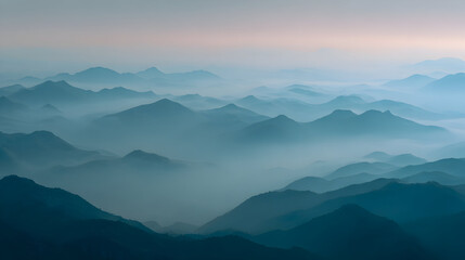 Naklejka premium Mist Shrouded Mountain Ranges In Soft Blue Hues Creating A Serene Landscape