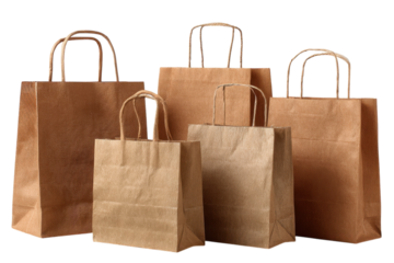 Brown paper bags group for shopping retail and consumerism against a dark background eco friendly