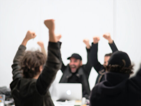 A DSLR photograph of a team celebrating a successful idea during a meeting. The shot is cinematic and full of energy. The white background is bright. The angle is celebratory, and the details are rich