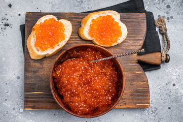 Salty salmon roe, red caviar, ideal for adding a touch of elegance to your culinary creations. grey ackground. top view