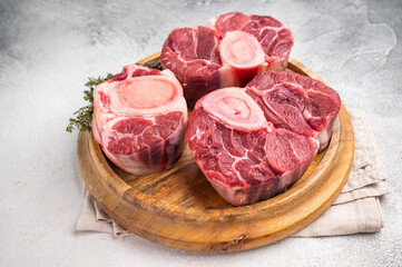 Beautifully marbled raw veal ossobuco, perfect cross cut shank meat for traditional Italian recipes and savory family dinners. white background. top view