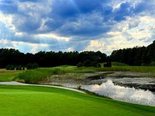 vivid pond reflection on the golf course