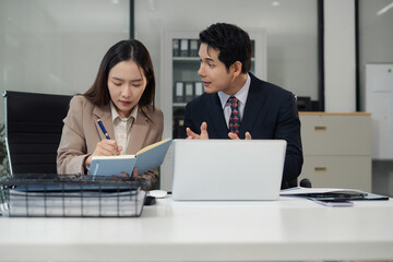 business team meeting with consultant and project planning charts.