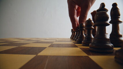 Unknown man playing chess closeup. Unrecognizable gamer engaged thoughtful game
