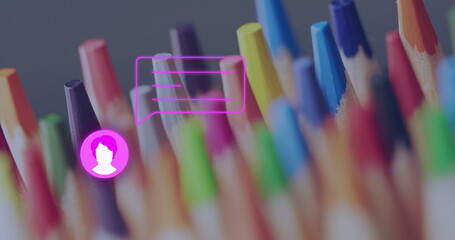 Showing colored pencil tips clustering on studio desk, with magenta chat bubble and user overlay