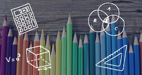 Showing pencils forming gradient on wood, with white math doodles, calculator and geometric shapes