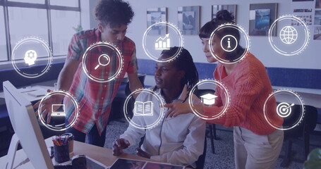 Collaborating three coworkers analyzing data on computer in office workspace, with interface icons