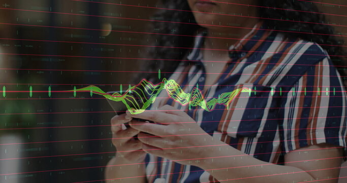 Holding smartphone, woman wearing striped shirt analyzing financial chart overlay on balcony