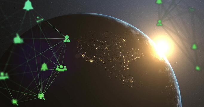 Naklejki Planet Earth showing night lights and sun rising over horizon in space, with digital network icons