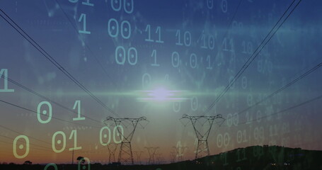 Fototapeta premium Extending high-voltage towers with cables stretching across hills at dusk, with binary code overlay