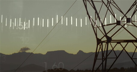 Showing transmission tower looming in hills at dawn, with power lines and data overlay, copy space