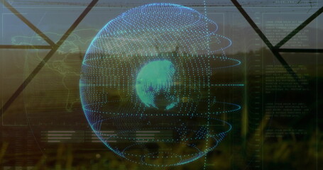 Projecting holographic globe orbiting with blue matrix points at window overlooking grassy field