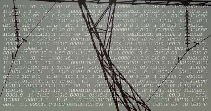 Steel lattice transmission tower carrying power lines, insulators in field with binary code overlay - Powered by Adobe