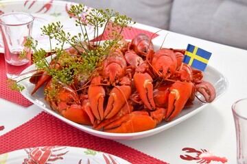 Crayfish parties in Sweden.On the plate are crayfish boiled in beer with dill