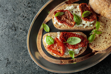 Ciabatta with sun dried tomatoes in olive oil, ricotta and basil.