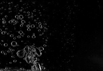 Underwater bubbles, Underwater oxygen design concept, Small water drops on black background, Close-up photography.