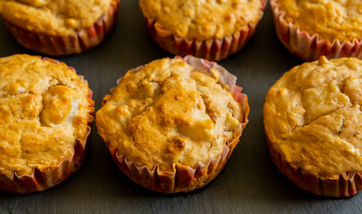 delicious pear muffin captured in close-up with a warm golden glow, perfect for autumn baking themes