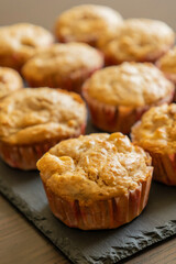 delicious pear muffin captured in close-up with a warm golden glow, perfect for autumn baking themes