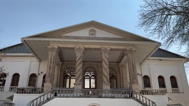 Tehran city attraction in Tajrish Square Ferdows Garden traditional architecture mansion old urban landscape. Palace with golden color iconic art museum landmark scenic walking in Middle East summer
