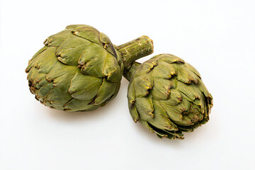 Obraz premium two artichokes on a white surface