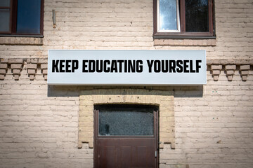 Fototapeta premium Motivational Message Keep Educating Yourself on Wall