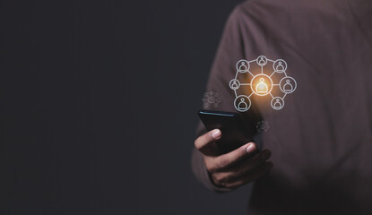 Young man hand using smartphone to Interconnect, Interconnected Concept; People connect via wireless internet in a world of digital technology and communications that connect freely around the world