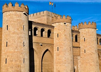 Aljafería Palace in Zaragoza exhibiting its magnificent architecture under a blue sky