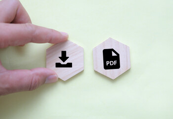 wooden square with PDF format file icon and download. the concept of saving a pdf file. concept pdf file save format