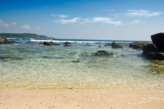 Beautiful tropical beach with great waves for surfing.