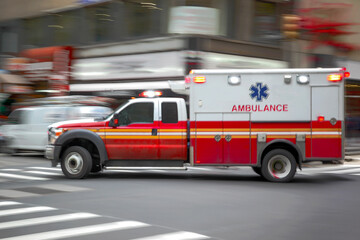 an ambulance drives down a city street