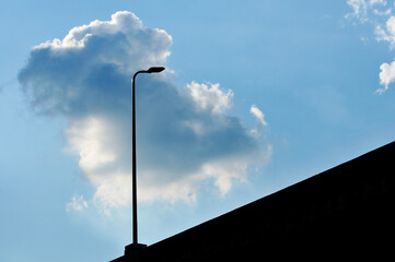 lamp post against blue sky