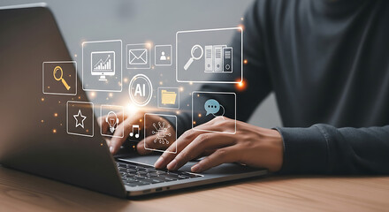 Person using a laptop with various digital business and technology icons floating above the keyboard