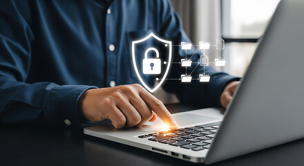 Man touching laptop screen displaying a security shield with a lock icon and data files