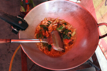 frying pan with meat and vegetables