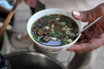 a bowl of soto grombyang