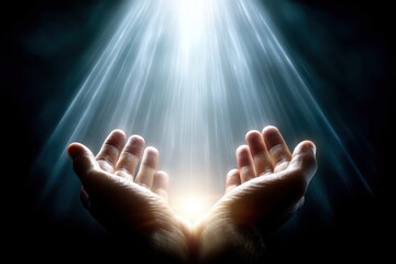 Hands cupped together reaching towards a radiant beam of light shining down from above in a dark, ethereal background