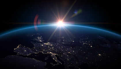  Sunrise over planet Earth. Planet Earth from the space. Europe at night viewed from space with city lights in Germany, France, Spain, Italy, Portugal, United Kingdom, Turkey.