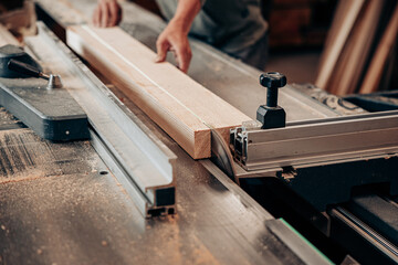 Cutting Timber on Table Saw in Woodworking Workshop